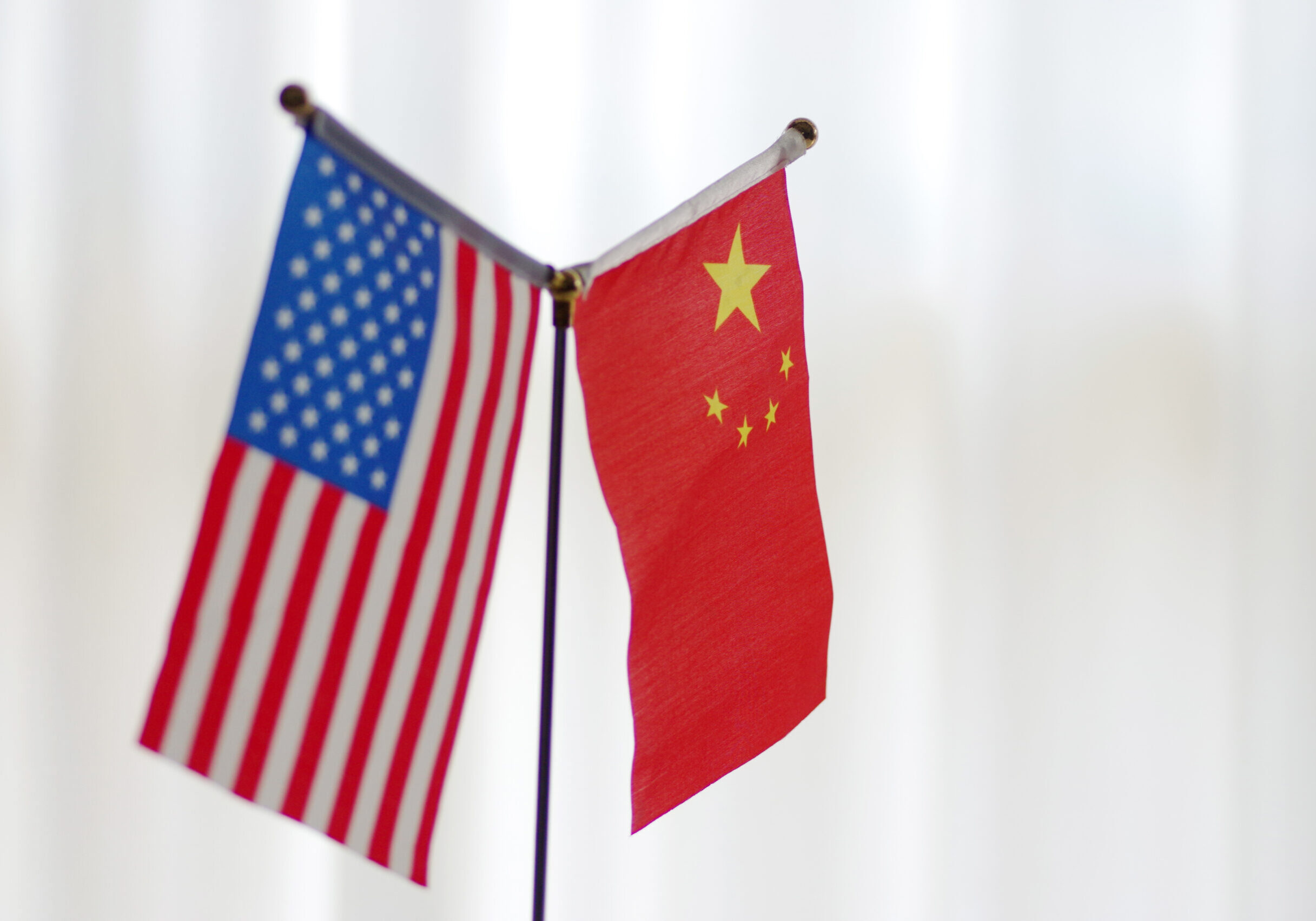 --FILE--National flags of China and the United States are seen in Ji'nan city, east China's Shandong province, 14 June 2018. 

US and Chinese negotiators on Monday (Jan 7) held their first face-to-face talks since the world's two largest economies agreed to a truce aimed at resolving their trade dispute. The visiting delegation, led by Deputy US Trade Representative Jeffrey Gerrish, left its hotel in Beijing Monday morning without speaking to reporters for a first day of talks. The two sides plan to continue discussions on Tuesday. President Donald Trump raised hopes last week that an agreement could be found to end the months-long dispute, during which the world's top two economies have imposed import duties on more than US$300 billion of each other's goods. "I think we will make a deal with China," Trump said on Friday.